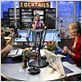 Next Caller : photo Collette Wolfe, Dane Cook, Joy Osmanski