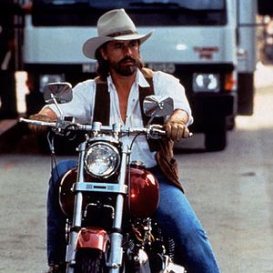 Photo Harley Davidson et l'homme aux santiags