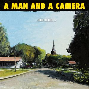 Photo A Man and a Camera